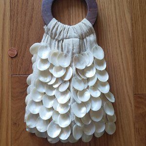 Pearl shell hand purse